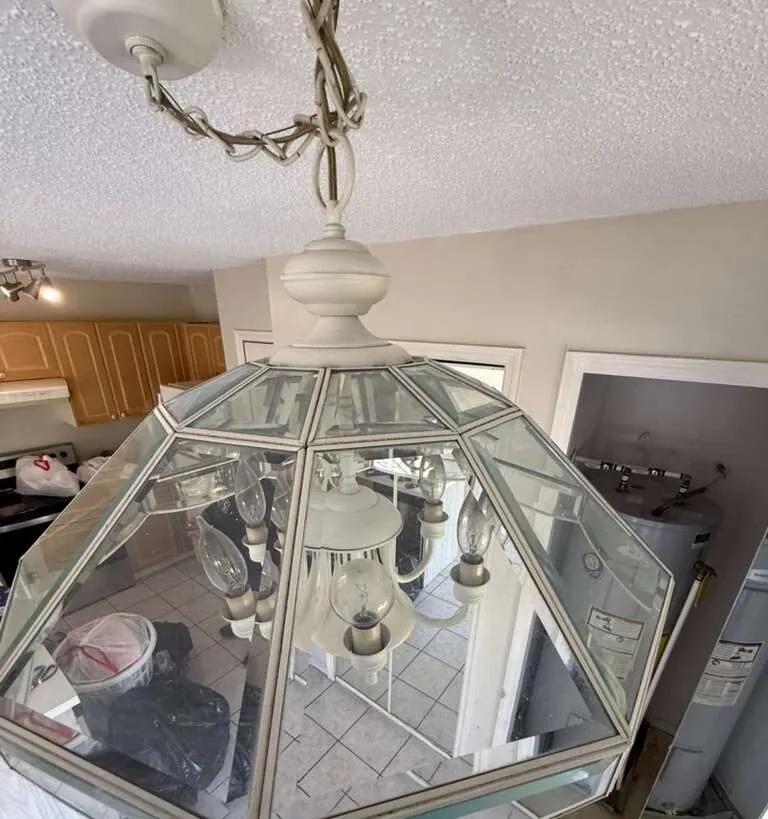 After: chandelier & light fixtures in a Winter Park home after a Go2 Workers deep cleaning