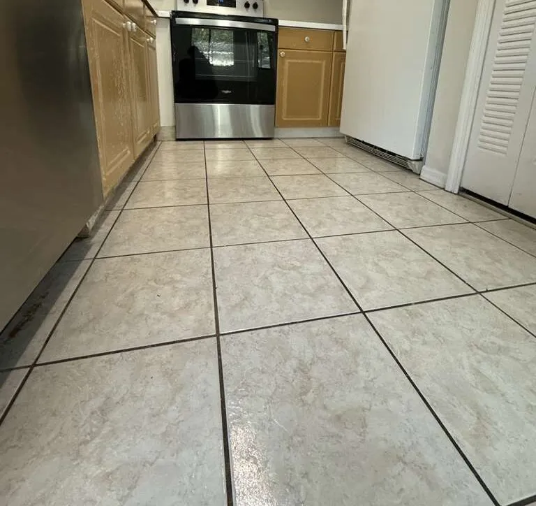 After: kitchen counter & floor in a Winter Park home after a Go2 Workers deep cleaning