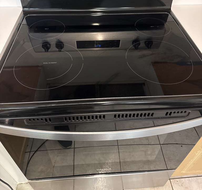 Stovetop — Glass cooktop polished free of burned-on residue. Go2 Workers deep cleaning, Winter Park, FL